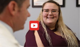 Woman considering weight loss surgery talking to physician